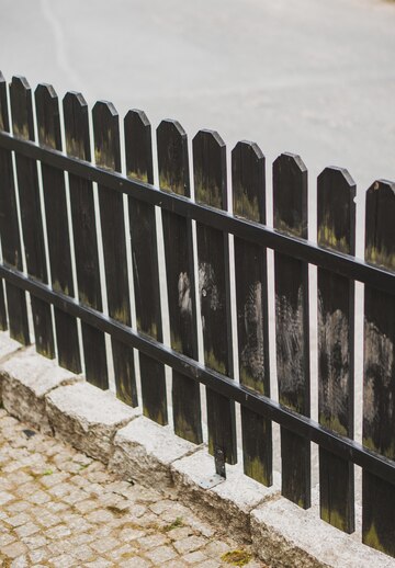vertical-shot-wooden-fence-street_181624-15424